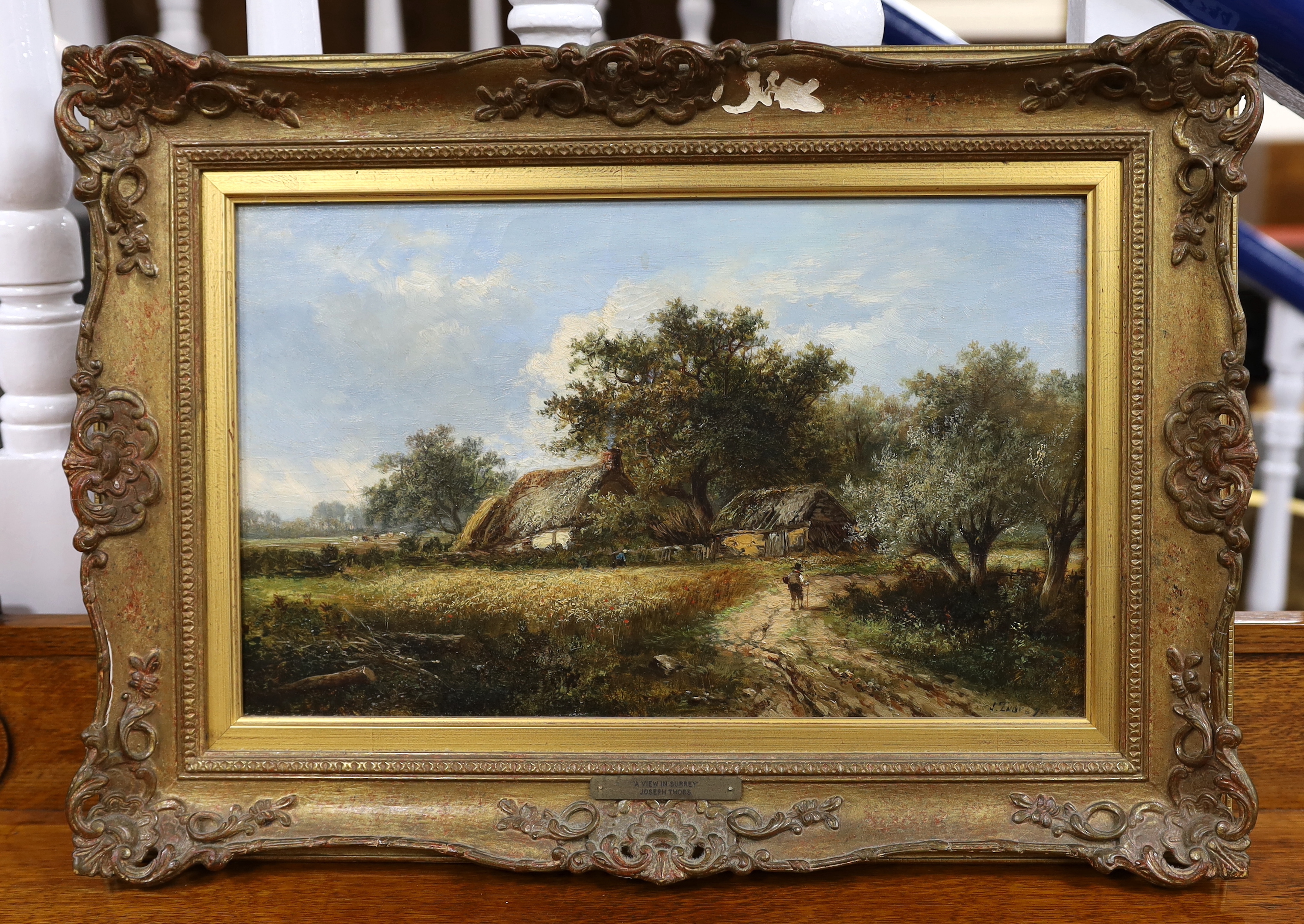 Joseph Thors (Dutch, 1843-1898), oil on canvas, Cornfields before thatched cottages, signed, 24 x 39cm